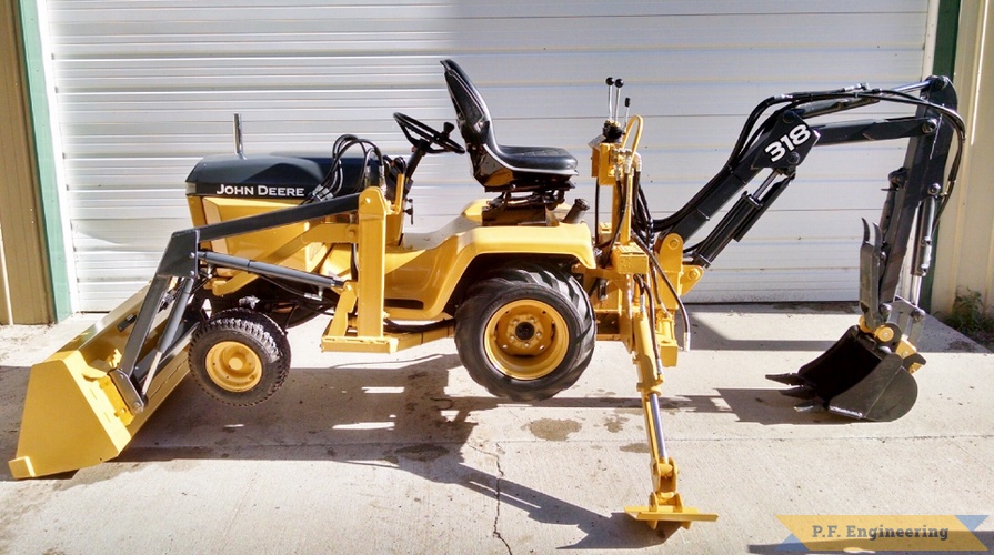 Jake T., John Deere 318 Micro Hoe | John Deere 318 Micro Hoe getting air by Jake T.