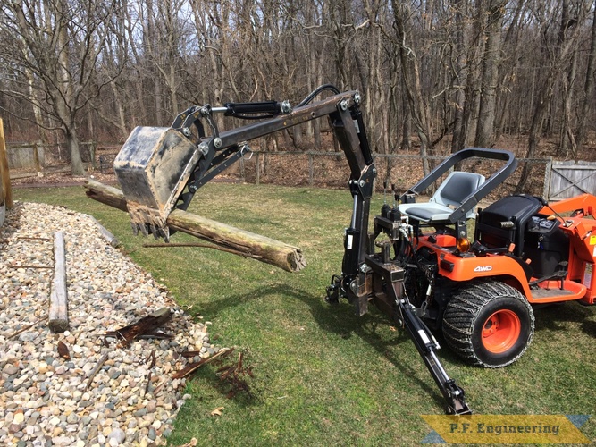 Mark J., Kubota BX2200 backhoe | Kubota BX2200 micro hoe picking up log with thumb by Mark J.