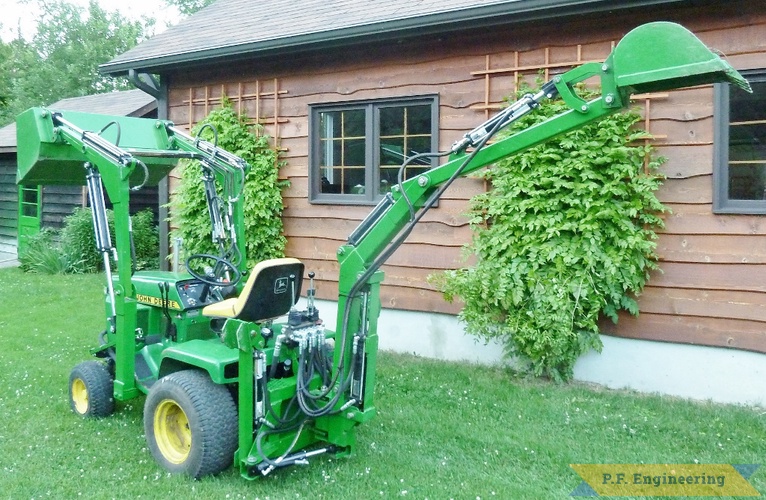 Walter K., Pointe Claire, Quebec. John Deere 318 Micro Hoe and loader | John Deere 318 Micro Hoe Loader rear view by Walter K., Pointe Claire, Quebec, CN