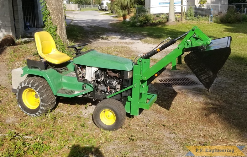 Ted L. Tarpon Springs, FL - John Deere 425 -  Pin-on Mini Payloader | Ted L. Tarpon Springs, FL JD 425 bucket dump