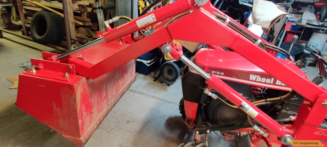 Don A. and his Wheelhorse 310-8 loader in Thibodaux, LA boom end modification for more bucket curl